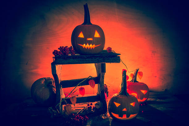 istock Halloween pumpkin lanterns dark light angry face fall 526948769