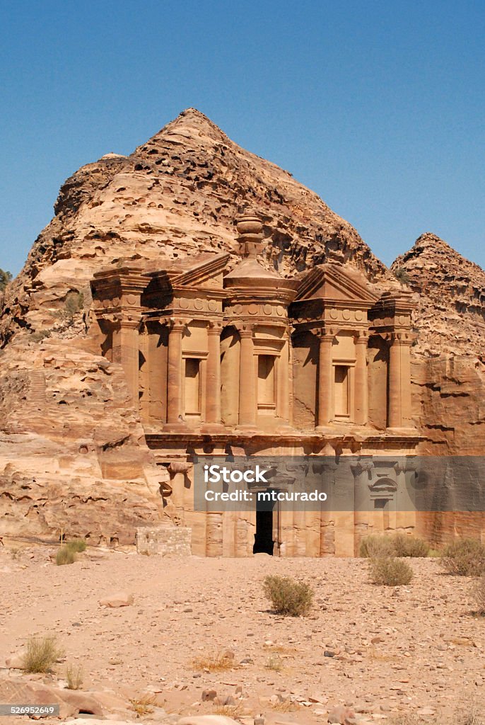 Petra monastery, Jordan Jordan,  Petra:  desert and the Monastery / Ad Deir, surrounded by the hill it was carved from - UNESCO world heritage site - photo by M.Torres Jordan - Middle East Stock Photo