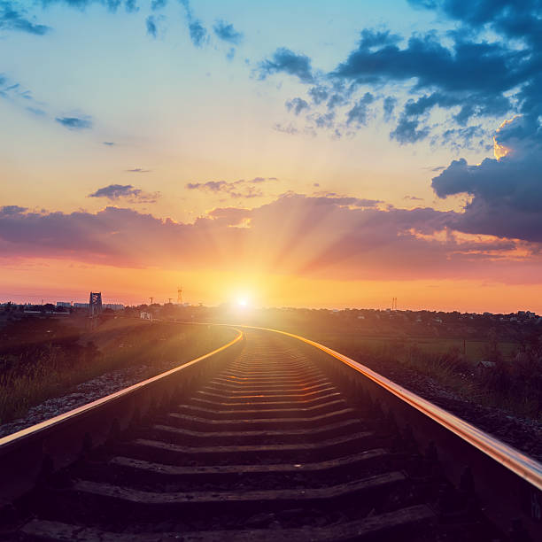 istock sunset over railroad to horizon 526954701
