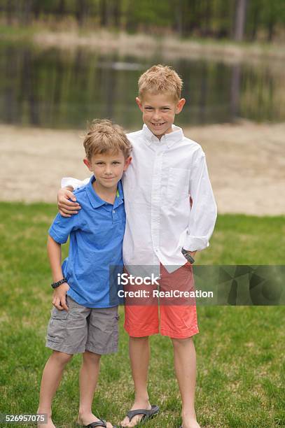 Two Brothers Outside Stock Photo - Download Image Now - Boys, Brother, Cheerful