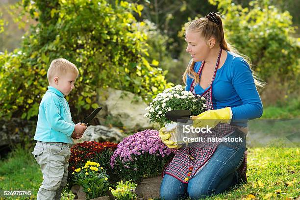 Young Woman With A Child Stock Photo - Download Image Now - Adult, Animal, Autumn