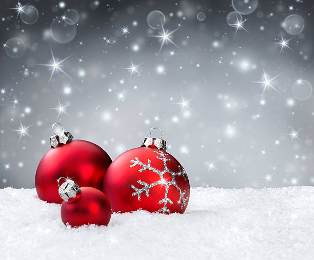 istock red christmas balls on snowflakes 526978173