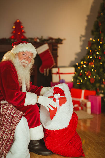 istock Happy santa claus stocking gifts 526978397