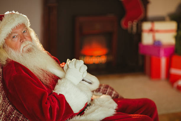 istock Santa claus relaxing on the couch 526978405