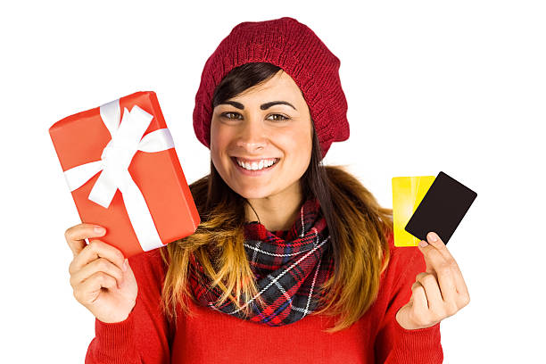 istock Smiling brunette holding gift and cards 526979173