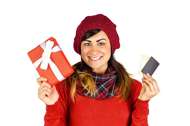 istock Happy brunette holding gift and cards 526979179