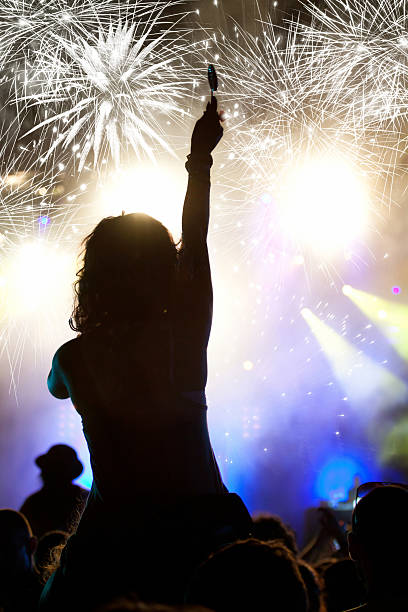 istock Crowd celebrating the New year with fireworks 526979389