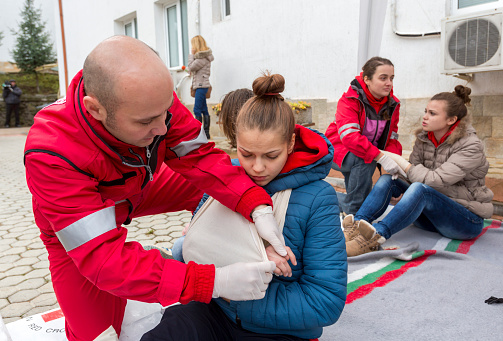Sofia, Bulgaria - December 5, 2014: Members from Bulgarian Red Cross Youth (BRCY) voluntary youth organization are participating in a training simulation of a natural disaster situation.