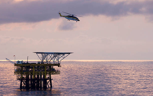 istock Helicopter and oil-rig 526979833