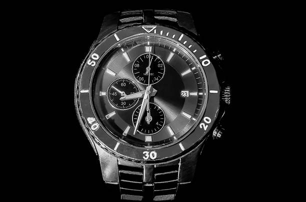 istock silver watch isolated on a black background 526980223