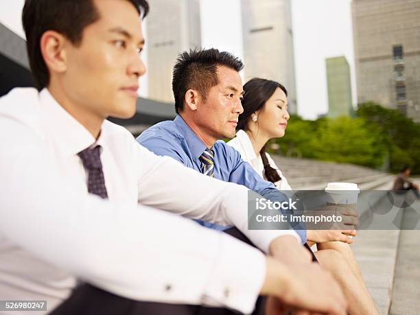 Team Of Asian Businesspeople Looking Frustrated And Depressed Stock Photo - Download Image Now