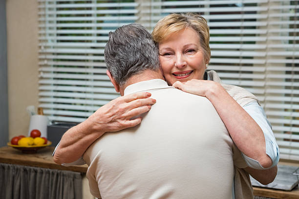 istock Senior couple hugging and smiling 526980269