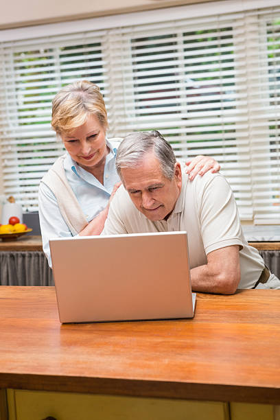istock Senior couple using the laptop together 526980457