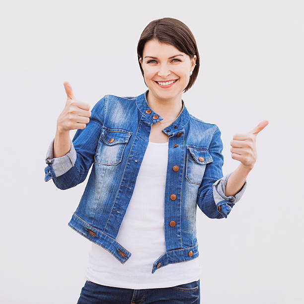 istock Happy girl giving thumbs up 526980579