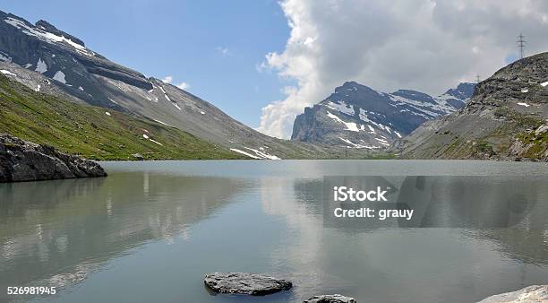 The Daubensee In Canton Of Valais Switzerland Stock Photo - Download Image Now - Cable, Cliff, Cloud - Sky