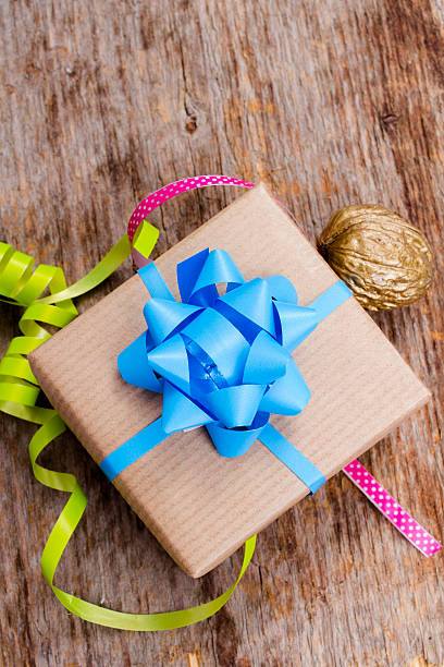 istock gift with colorful ribbon on a wooden table 527009871