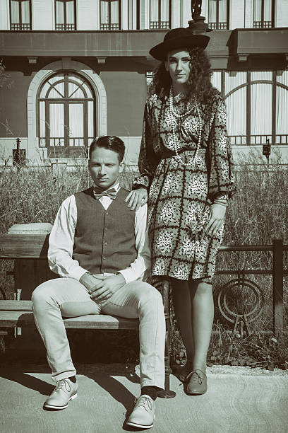 istock Couple in romantic vintage style together on the bench 527010743