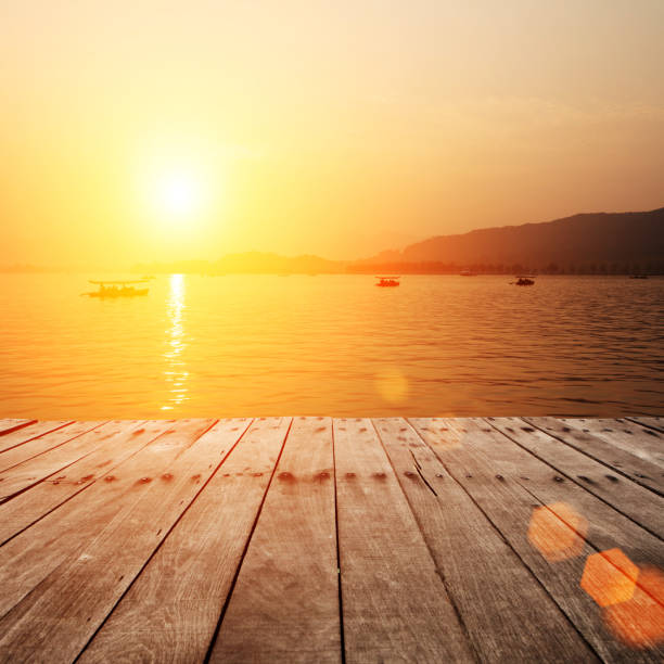 istock plank board with lake in sunset as background 527012131