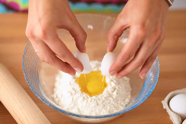 istock young woman in the kitchen, isolated on background 527013537