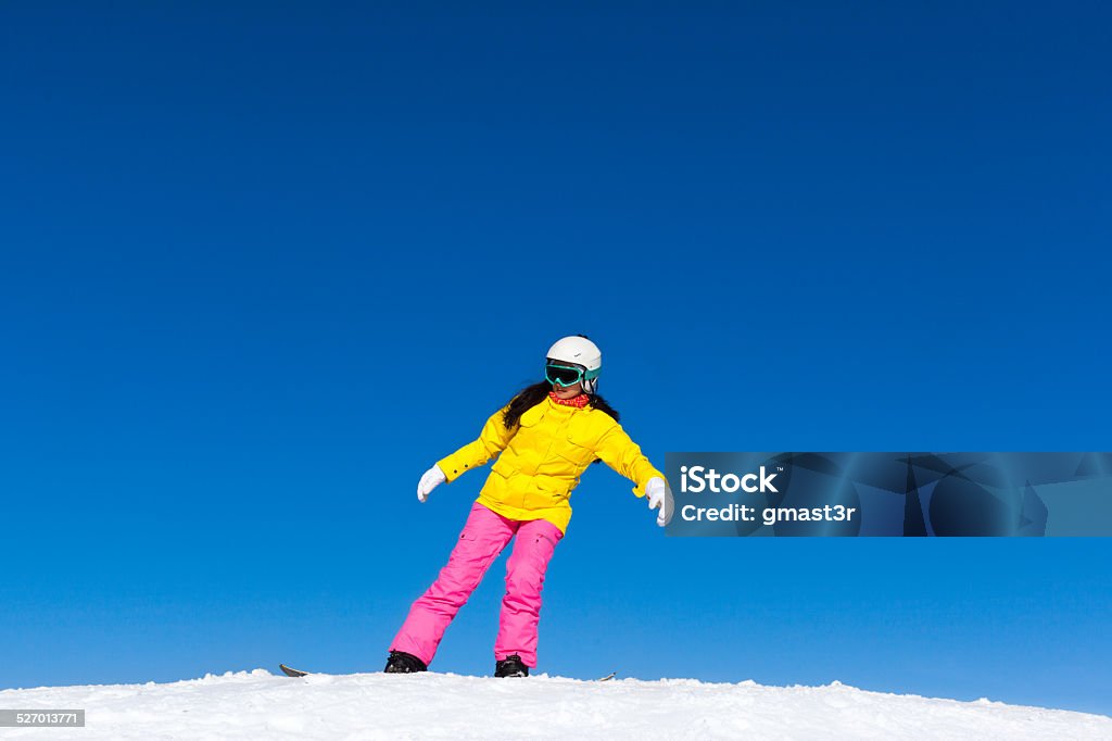snowboarder girl making stunt trick on snowboard snowboarder girl making stunt trick on snowboard, snow mountain slope copy space blue sky Active Lifestyle Stock Photo