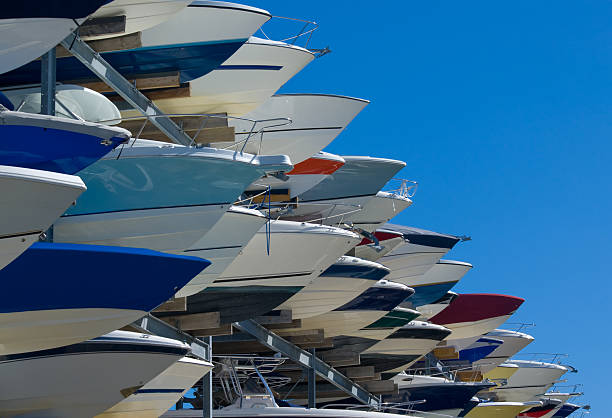 Boats in storge Boat stored at a marina on metal racks. dry dock stock pictures, royalty-free photos & images