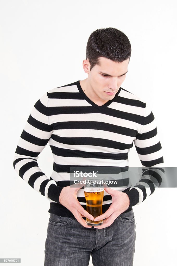 man with a glass of beer young man with a glass of beer Adult Stock Photo