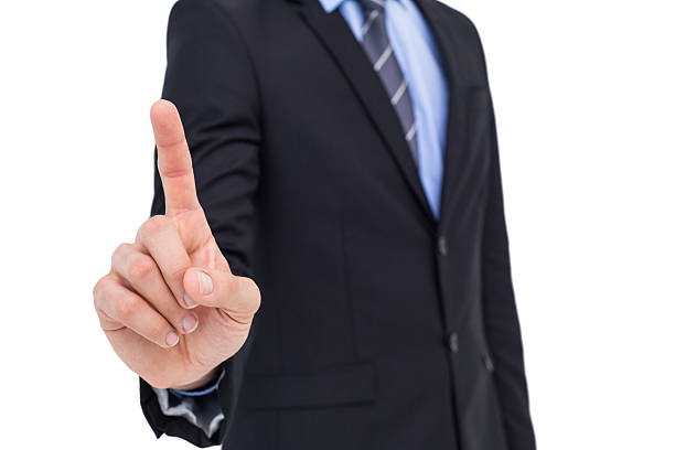 istock Mid section of businessman pointing something up 527016015