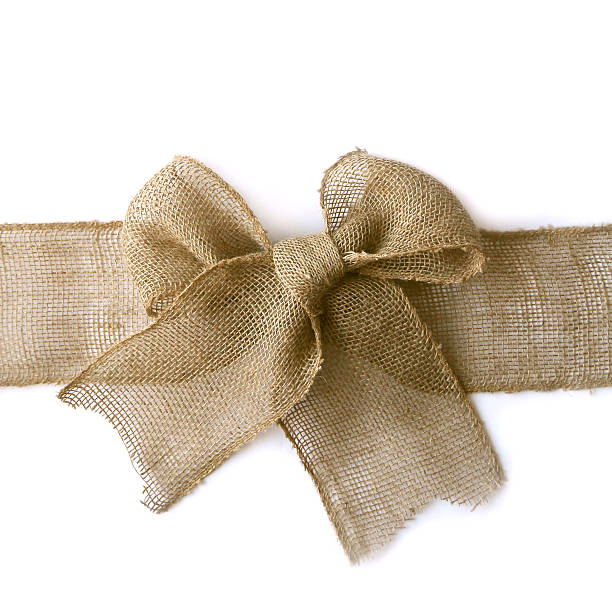 istock Burlap Christmas Bow Wrapped Around White Background 527016709