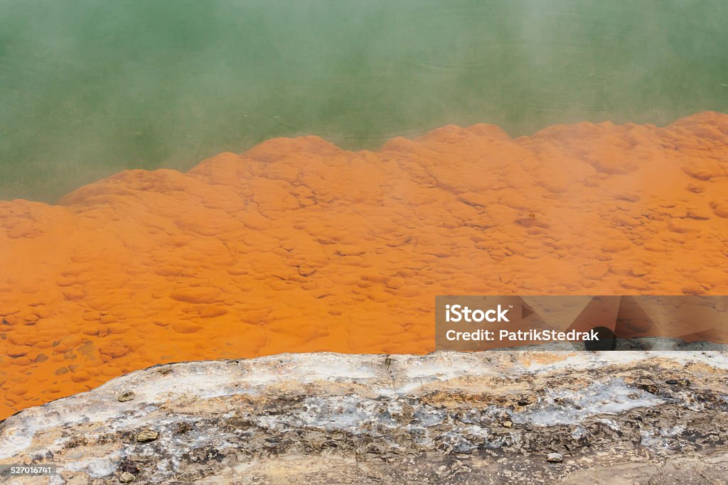 orange deposits on ledges of Champagne pool orange deposits on ledges of Champagne pool in Waiotapu, New Zealand At The Edge Of Stock Photo