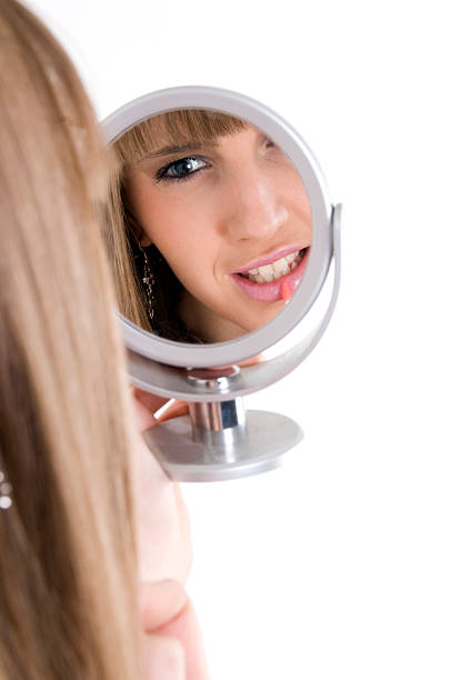 istock Female model with make up and mirror 527025815