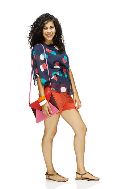 istock Happy young woman standing with purse 527026209
