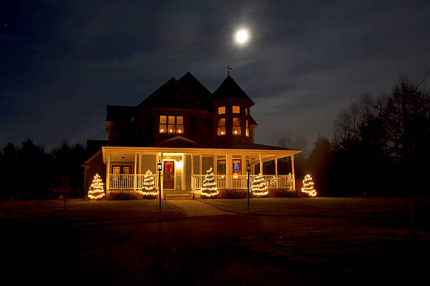 istock Victorial House at Christmas with Full Moon 527026307