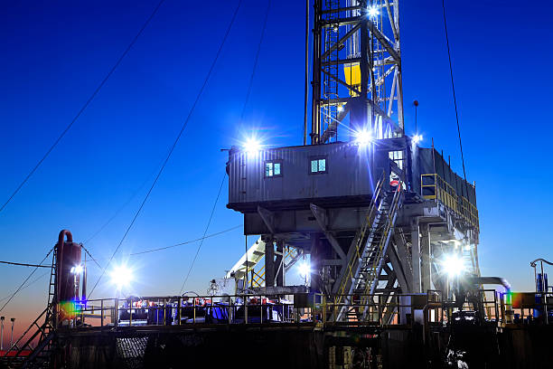 istock oilfield derrick at night 527029014