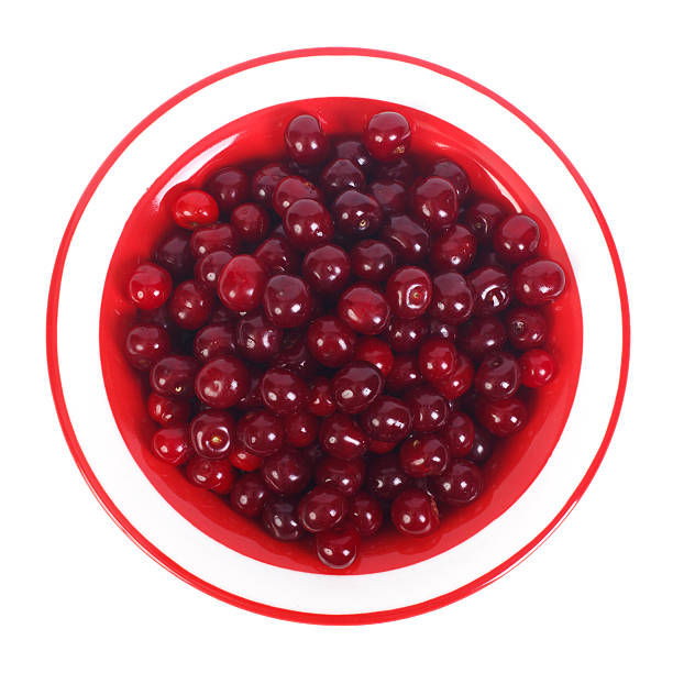 istock red cherries in bowl isolated on a white background 527029461