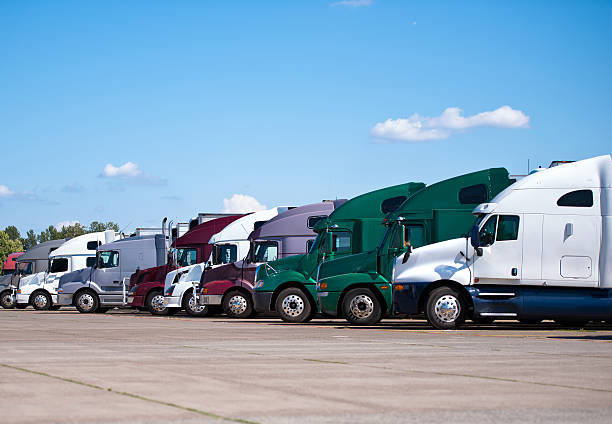 istock Semi trucks lined up on truck stop classic and modern 527029675