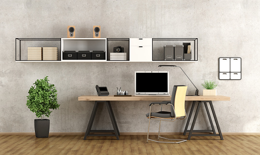 Contemporary home office with  laptop on minimalist desk - 3d rendering-