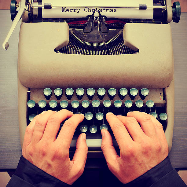 istock merry christmas typewritten in a paper sheet on a typewriter 527030501