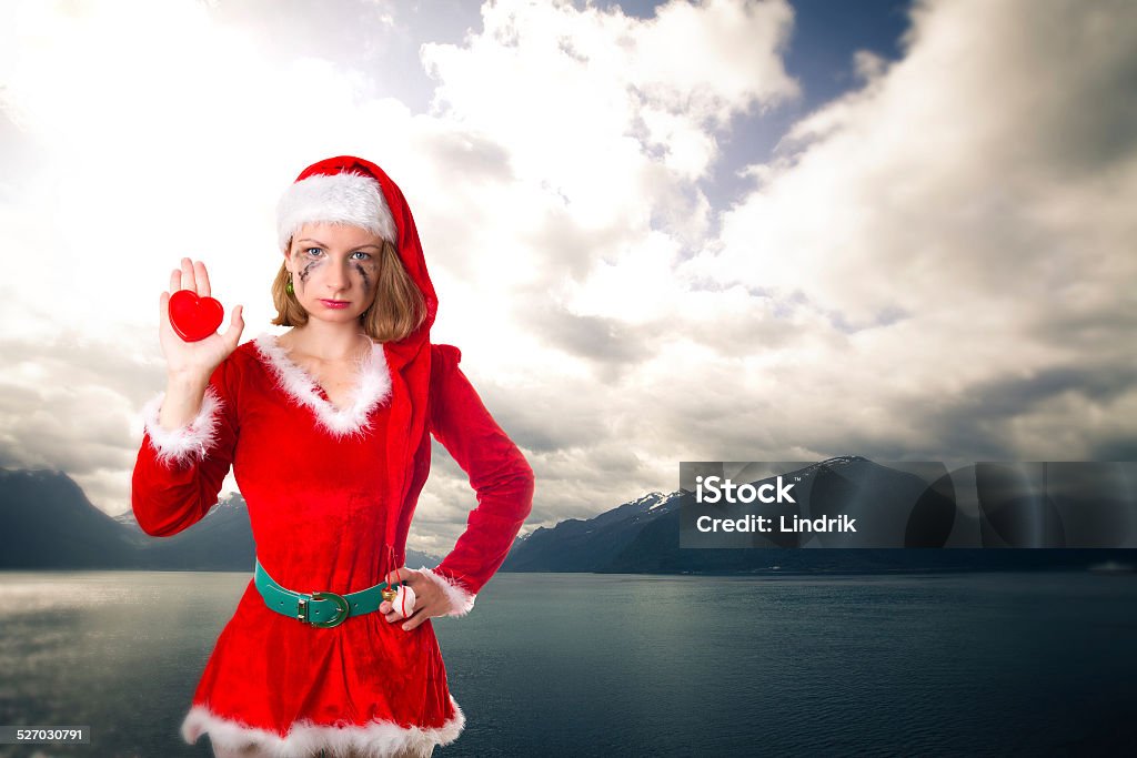 Northern Norwegian fjords. santa girl cries humor heart . scenic landscapes of the northern Norwegian fjords. Adult Stock Photo