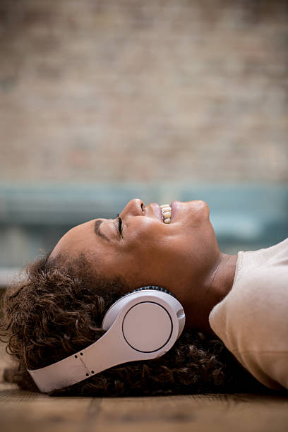 istock Happy woman with headphones 527031683