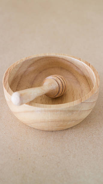istock Wooden bowl and dipper on brown background 527031980