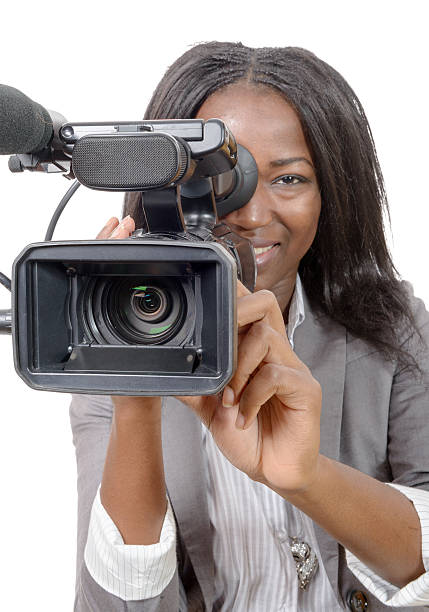 istock young African American women with professional video camera 527032232