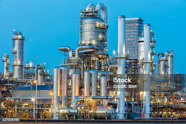 Petrochemical Plant Illuminated At Dusk Stock Photo - Download Image Now - Chemical Plant, Industry, Netherlands