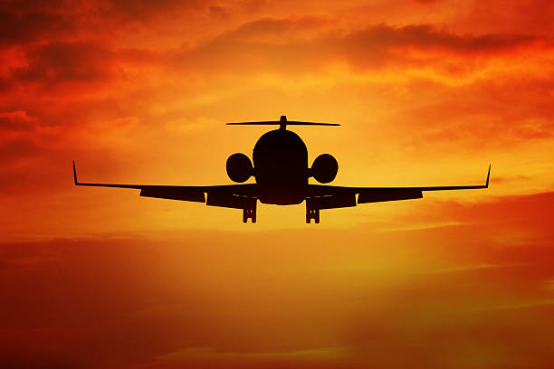 istock Aircraft flying on the orange sky 527036494