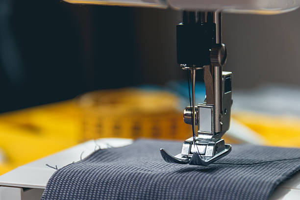 sewing machine and item of clothing stock photo