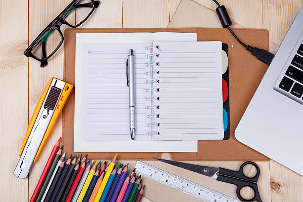 istock Workplace with colored pencils and supplies 527039508