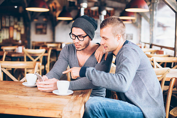 istock Young friends drinking coffee in a bar 527042960