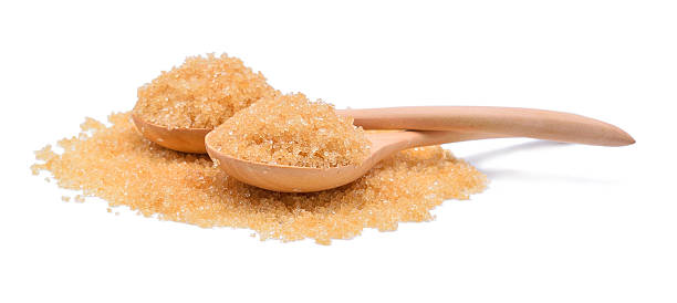 istock brown sugar in a wooden spoon isolated on white 527046434