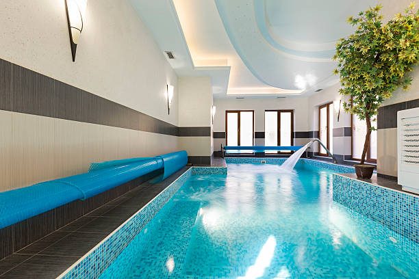istock Indoor swimming pool at spa center 527046444