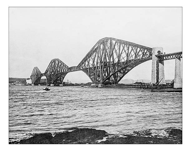 Antique photograph of Forth Bridge over Firth of Forth (Scotland) Antique photograph of the Forth Bridge over the Firth of Forth near Edinburgh (Scotland, UK) in a late 19th century photograph. It is a cantilever railway steel bridge built in the second half of the 19th century, a masterpiece of engineering that become a UNESCO World Heritage Site. fife county stock illustrations