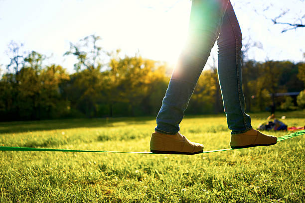 istock Woman walking on a slackline 527047400